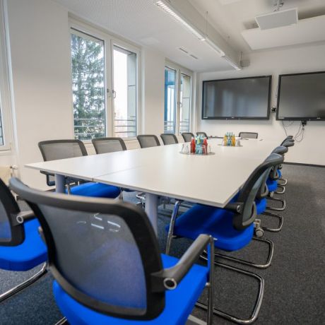 Modern TUDIAS seminar room with blue chairs